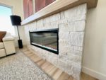 A stacked stone fireplace.
