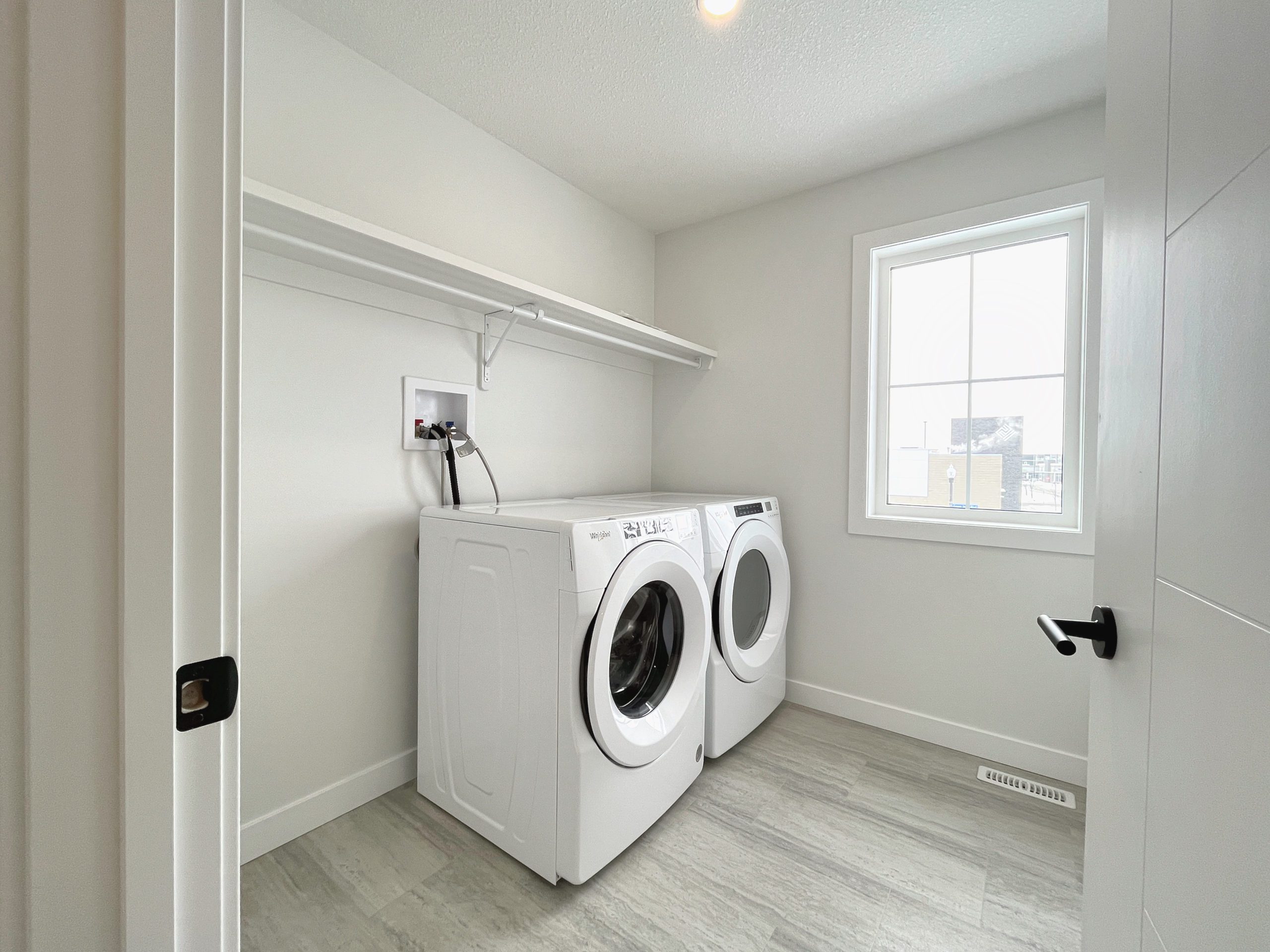 Upstairs laundry room with a washer and dryer.