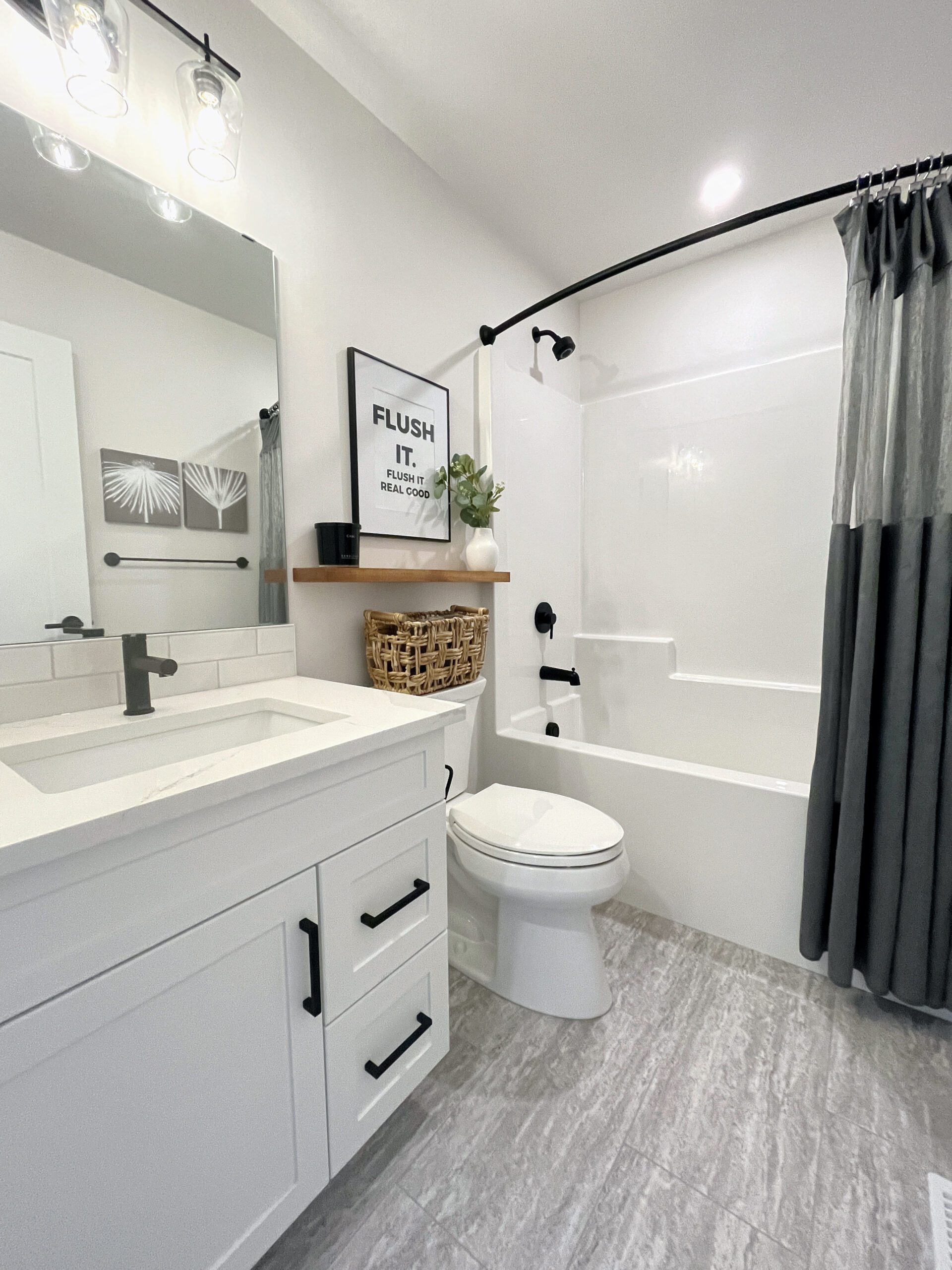 A two-storey home in Pilot Butte with a sink and a toilet.